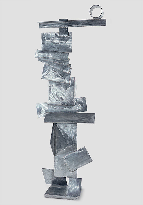 A steel sculpture of various rectangular shapes stacked on top of each other.