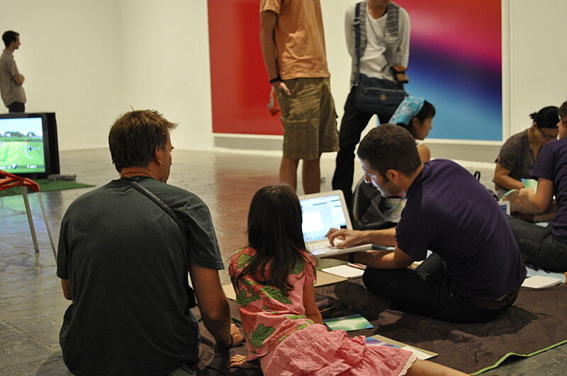 Families taking part in an artistic workshop