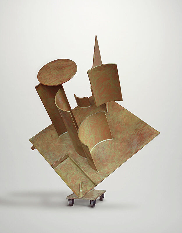 A steel sculpture of various circular and rectangular shapes stacked on each other.