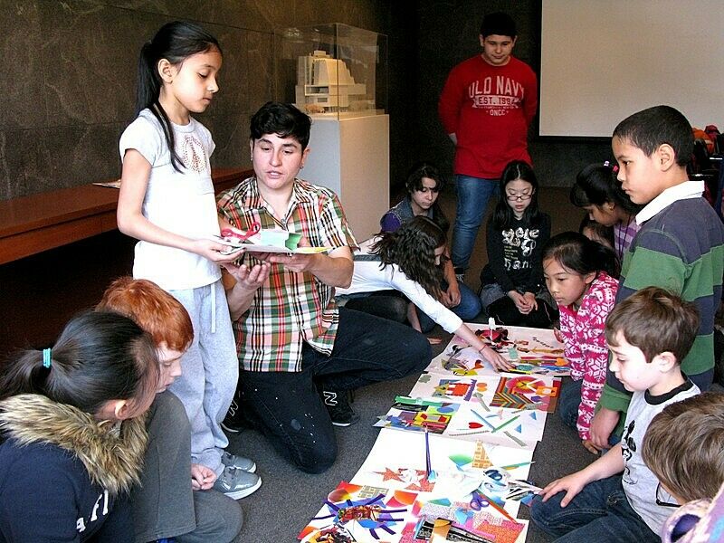student and artist working on collages
