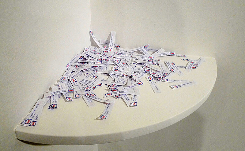 Tickets stacked up in the corner of a room.