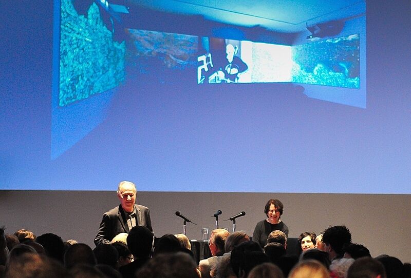 An audience watching filmmaker Werner Herzog discuss his work