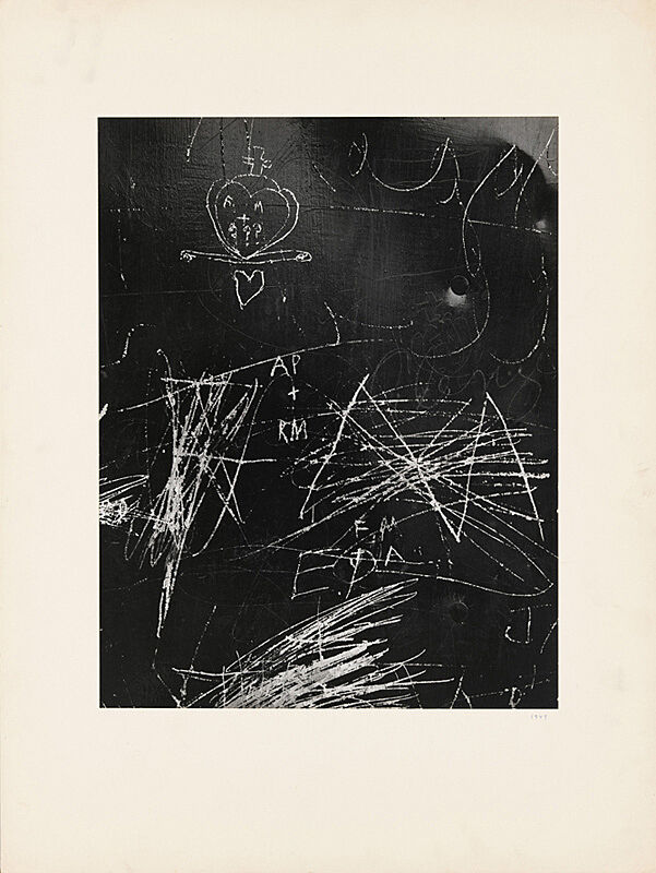A print of white scratches on a black surface.