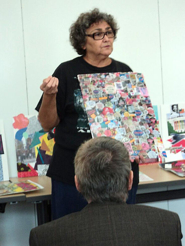 A senior citizen presents a collage she made that incorporates political buttons.