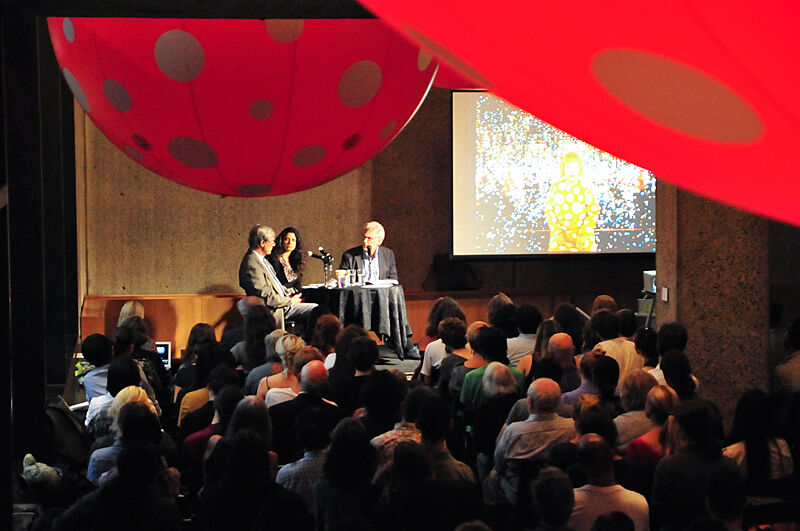 A panel discussion in front of a live audience.