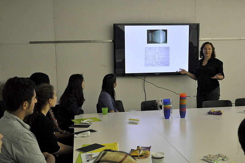 woman presenting to class on a large monitor