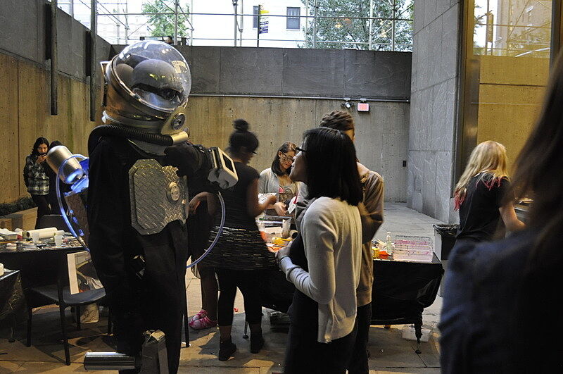 Michelle, a Youth Insights Leader, talks to an intergalactic guest in the Whitney's Sculpture Court