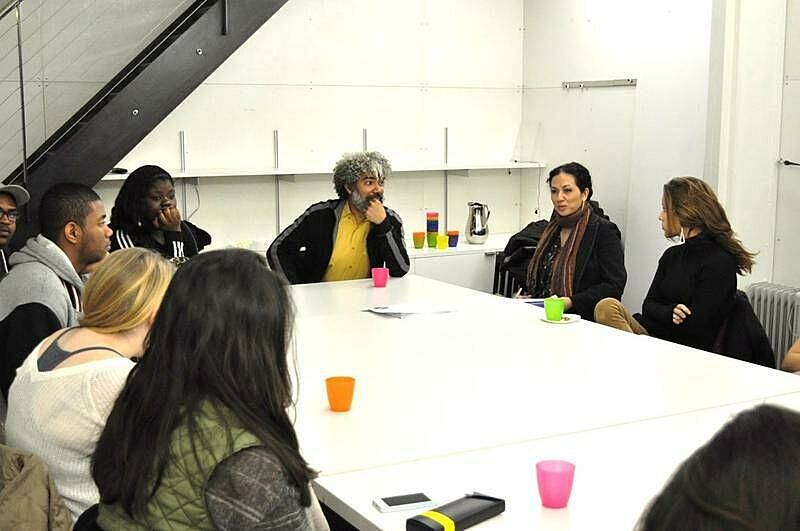 Artists and students in table discussion