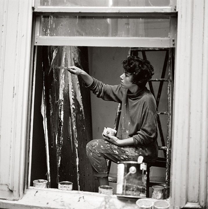 A photograph of Jay DeFeo working in her studio.