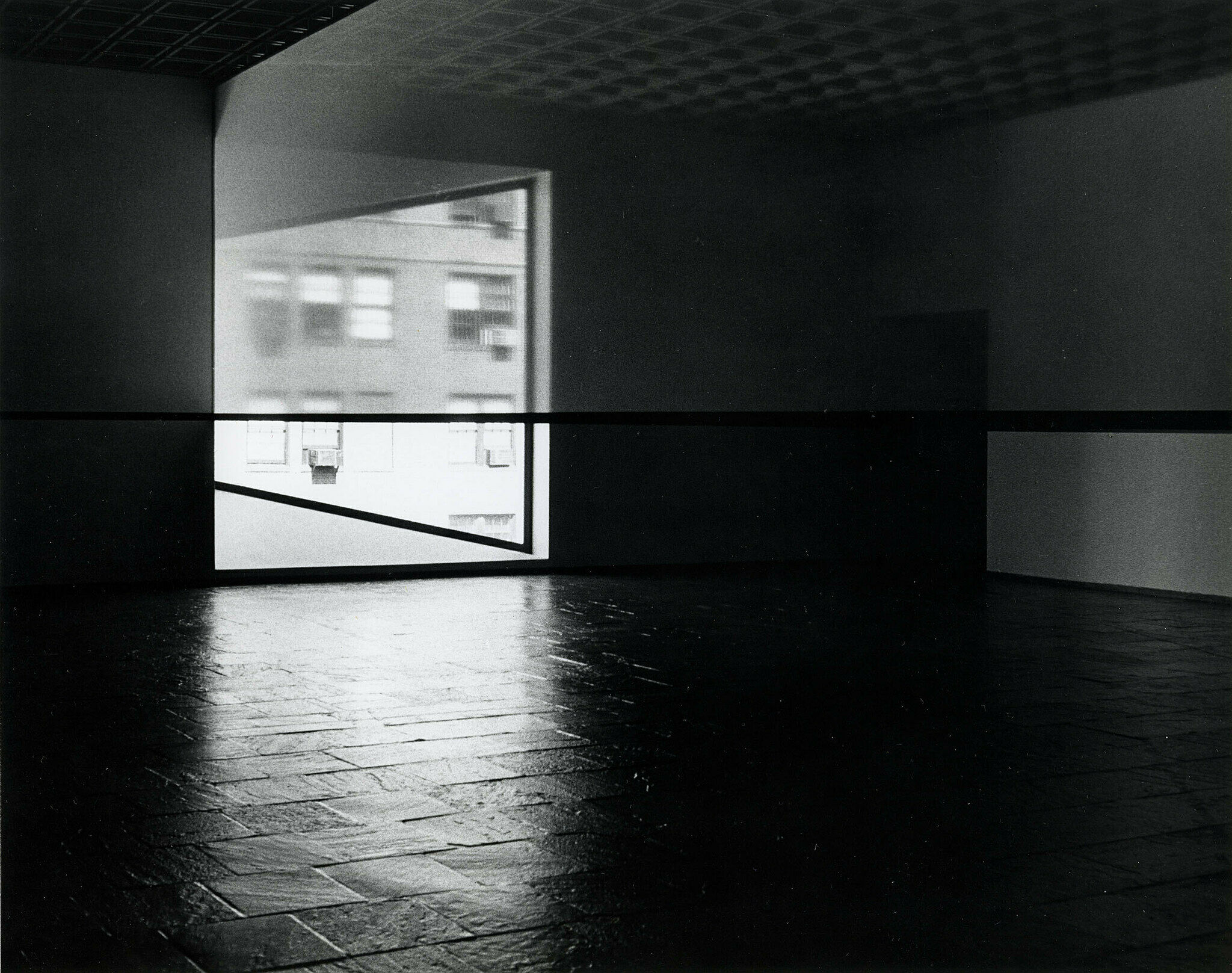 A translucent scrim runs across the gallery in a 1977 installation by Robert Irwin.