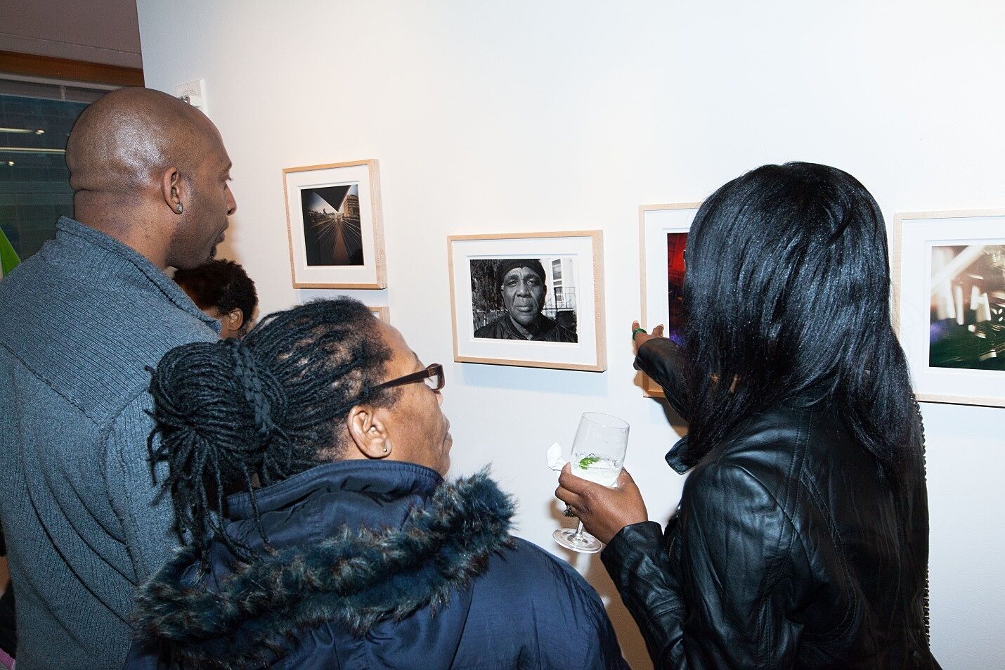 Guests discuss artwork.