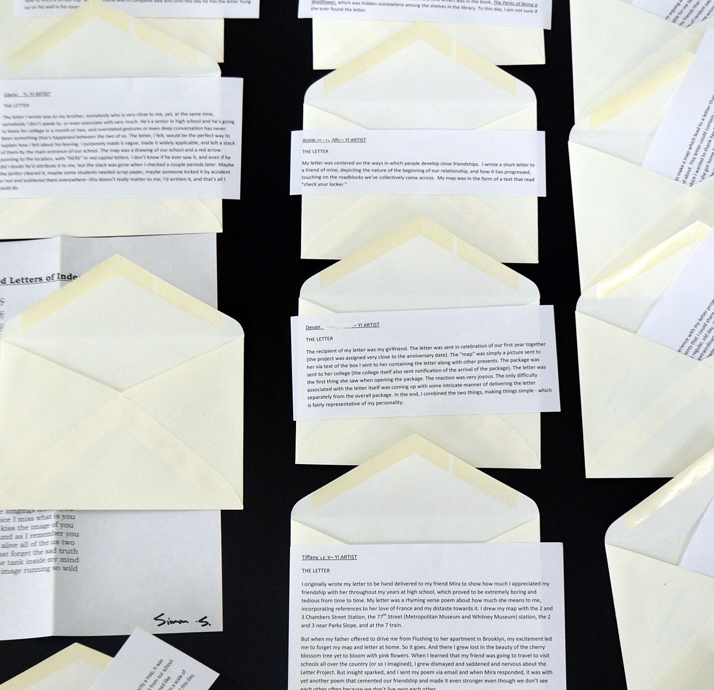 letters in front of envelopes