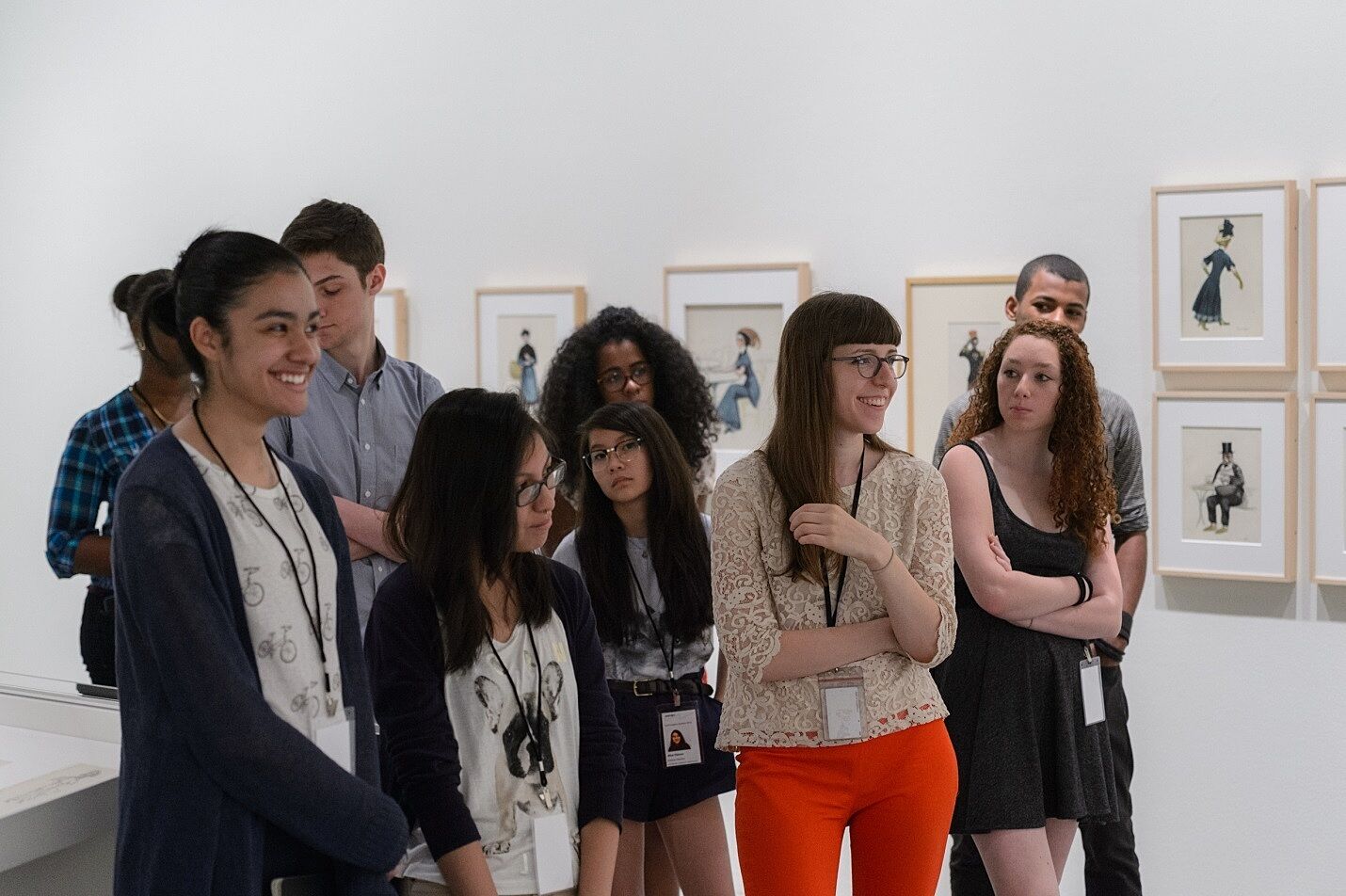 A group of teens stands in the gallery of the Edward Hopper exhibit.