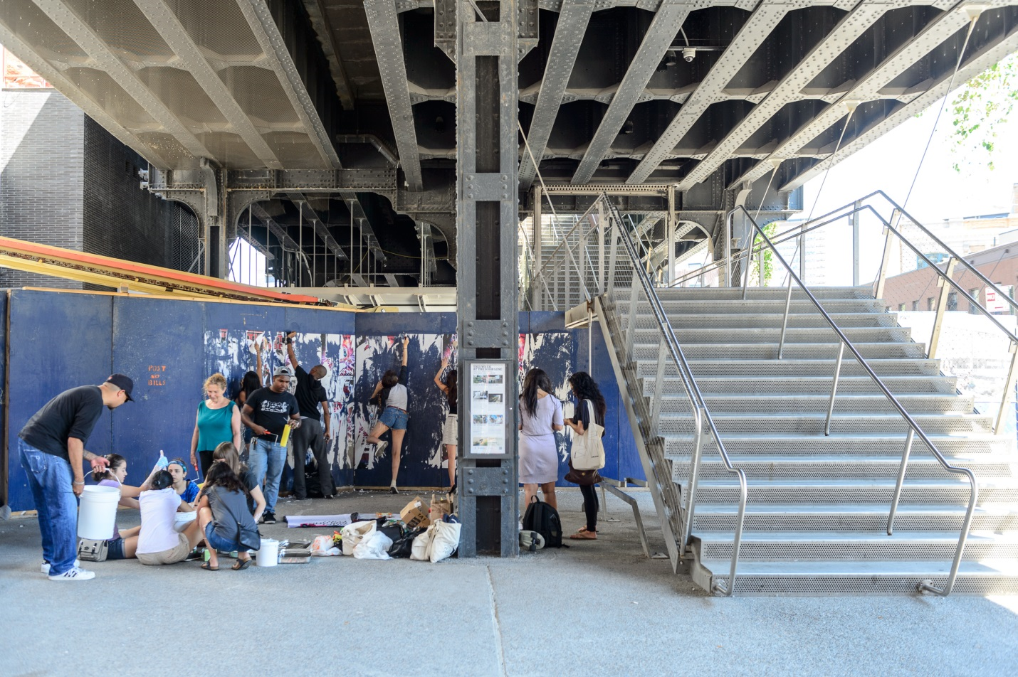 Students putting up posters near the High Line