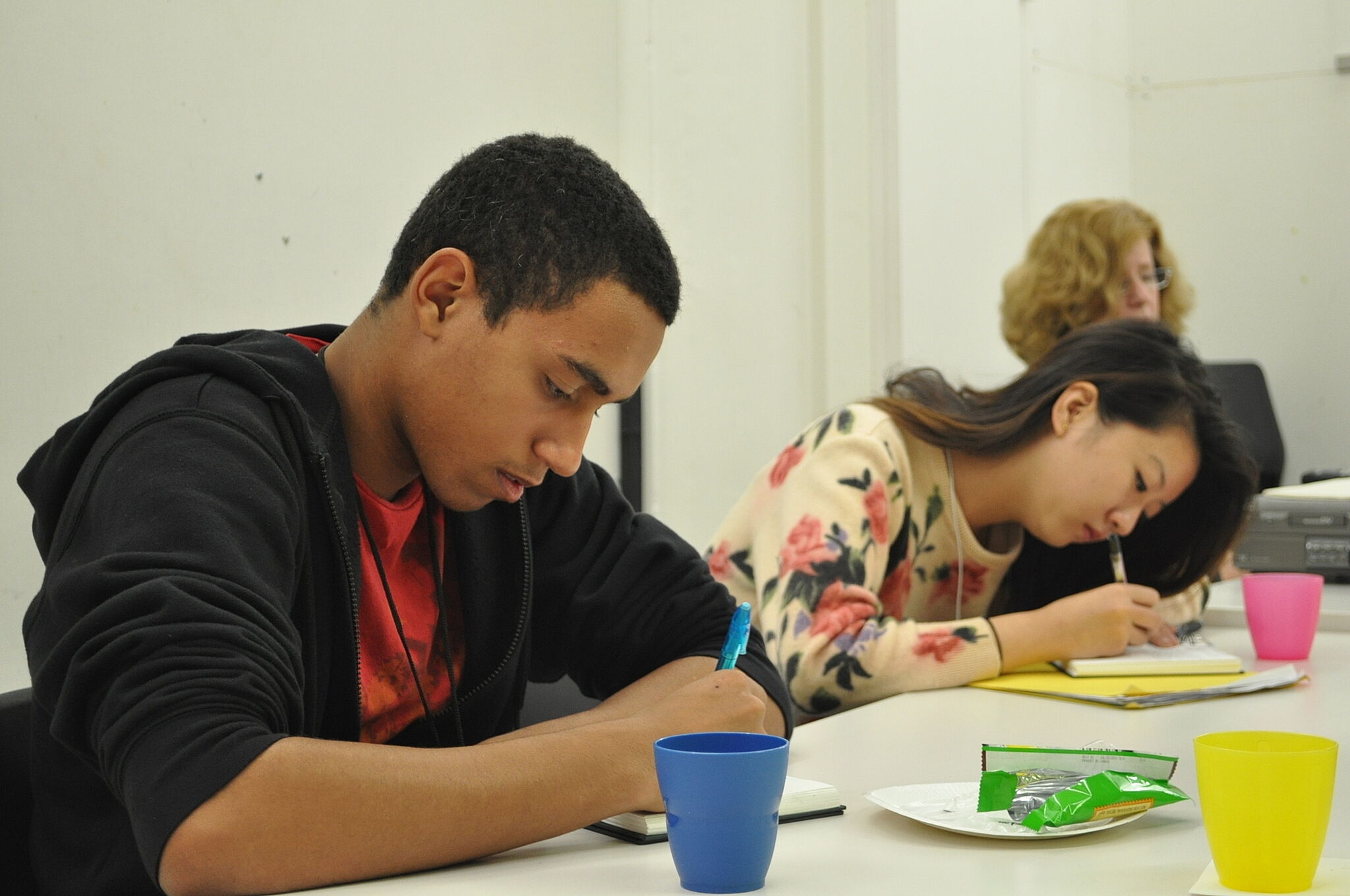 students writing on notepads