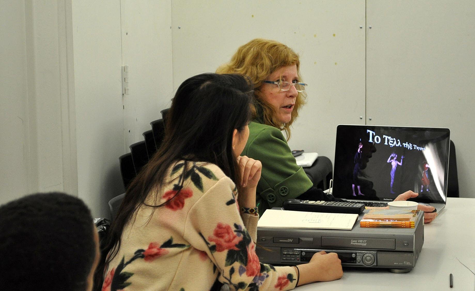 teacher showing her work from a laptop