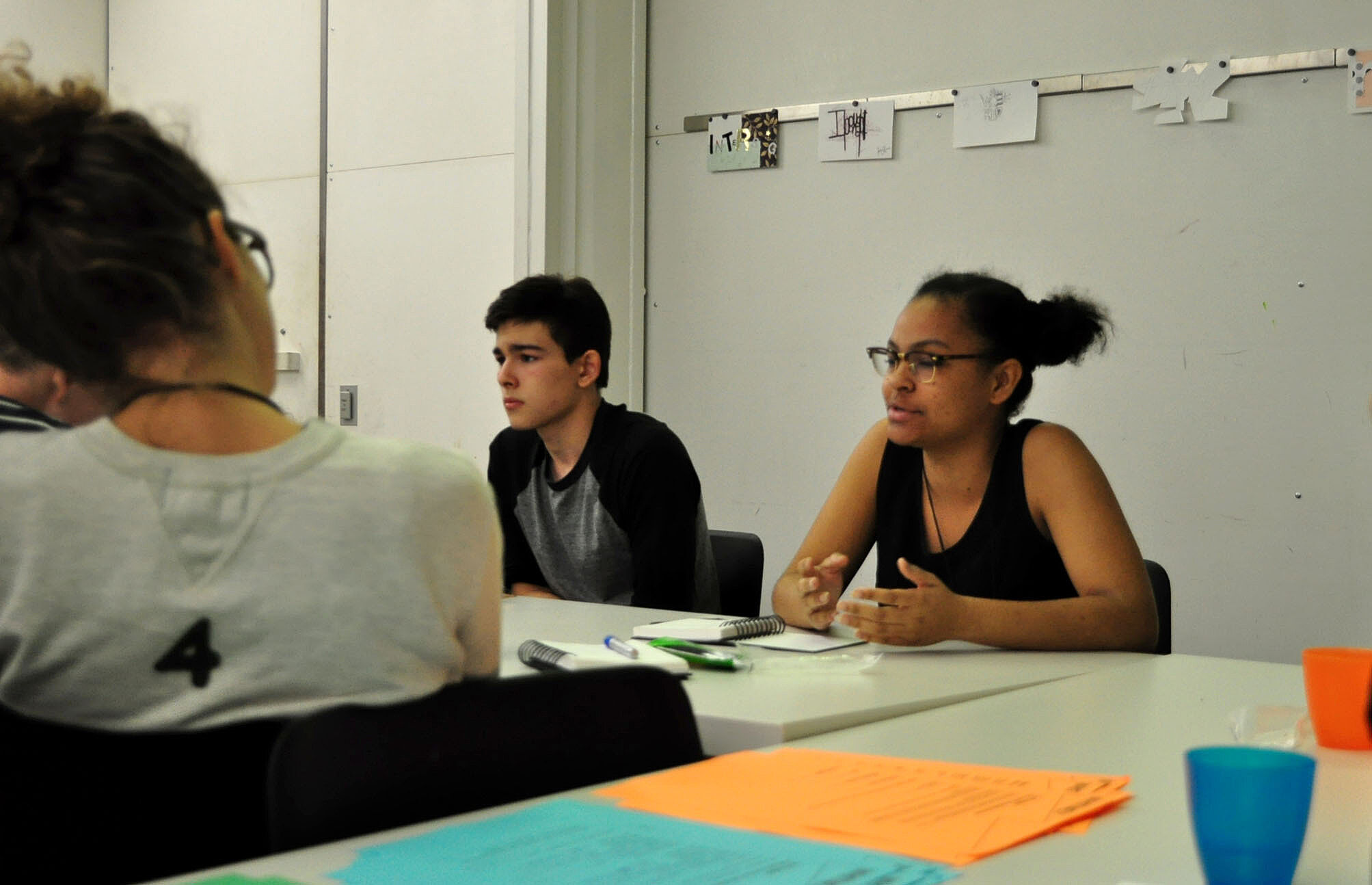 students discussing around a table