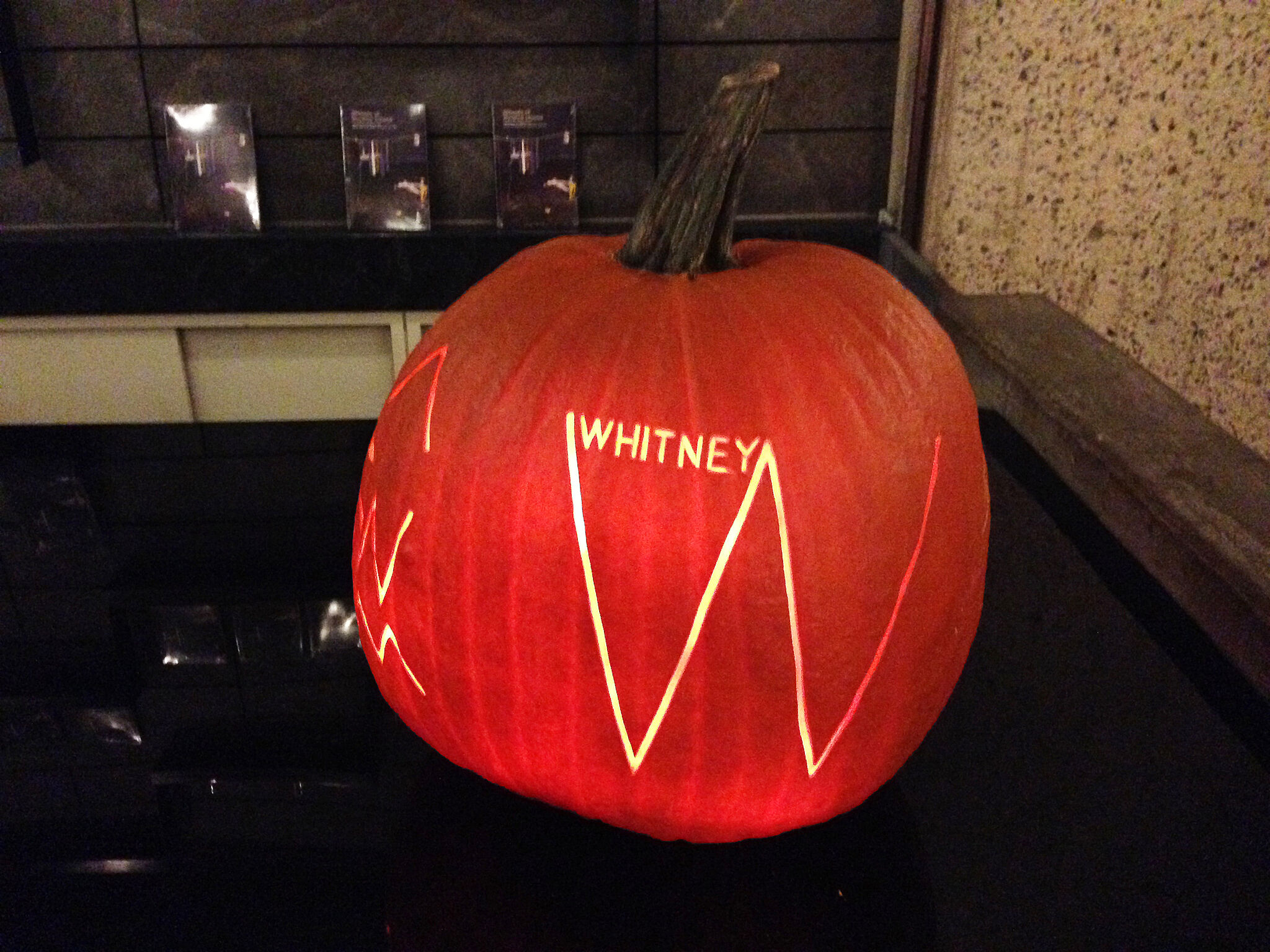 A pumpkin with a Whitney logo on it