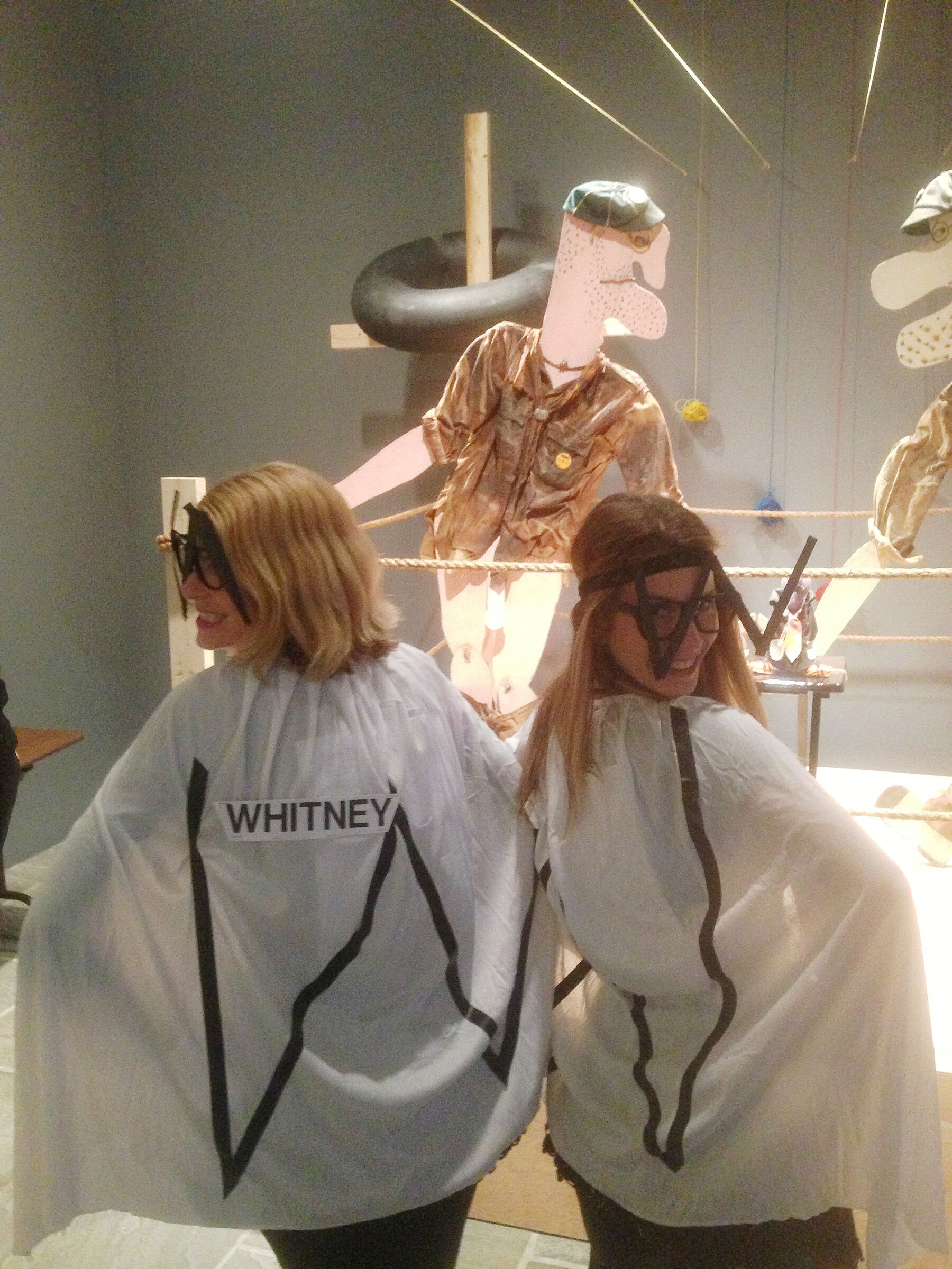 Two museum staff members dressed in costumer