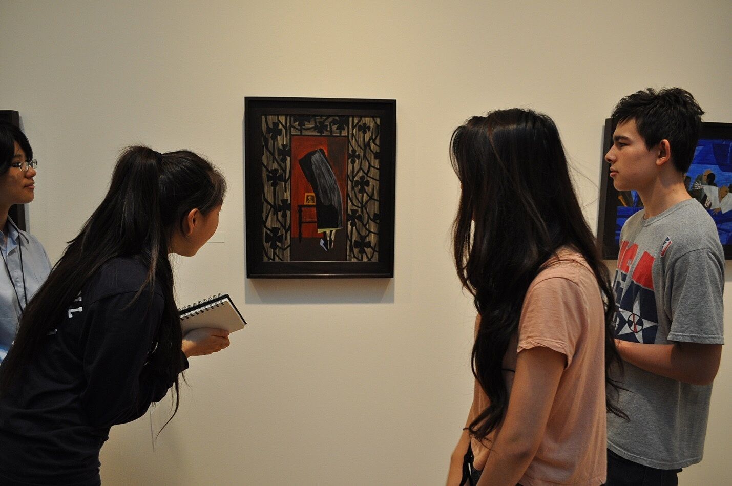 Students examine artwork