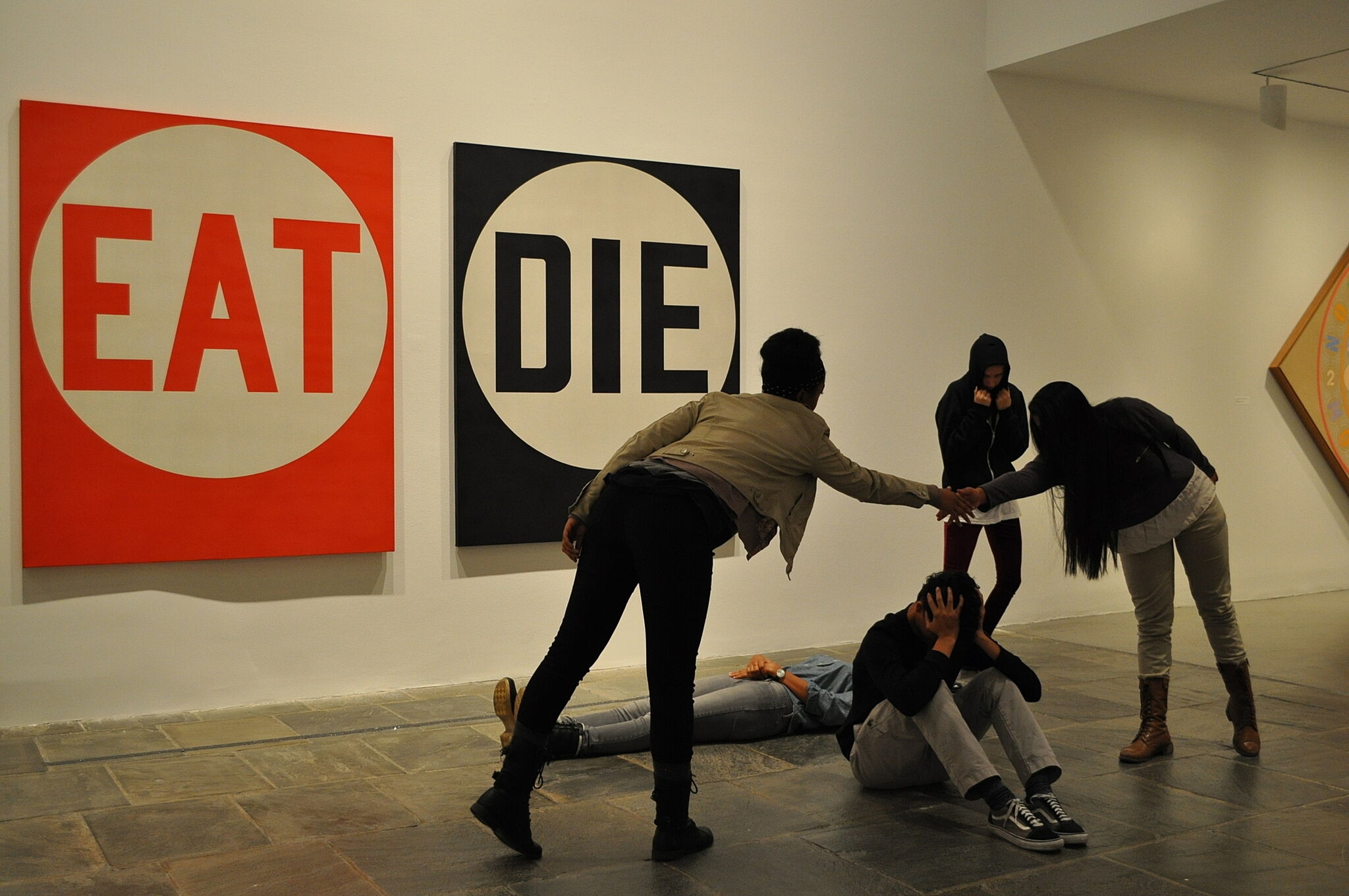 teens performing a dance in a gallery