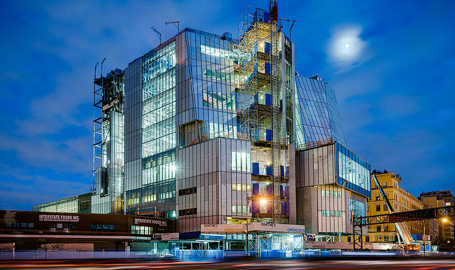 whitney museum building from exterior at dusk