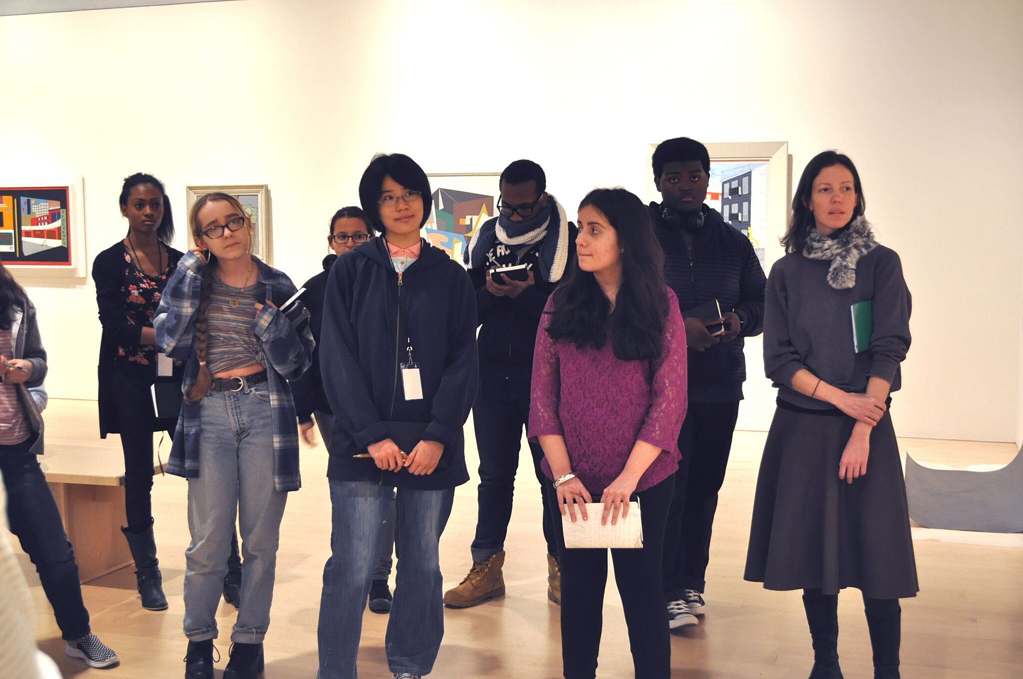 Participants discussing art works