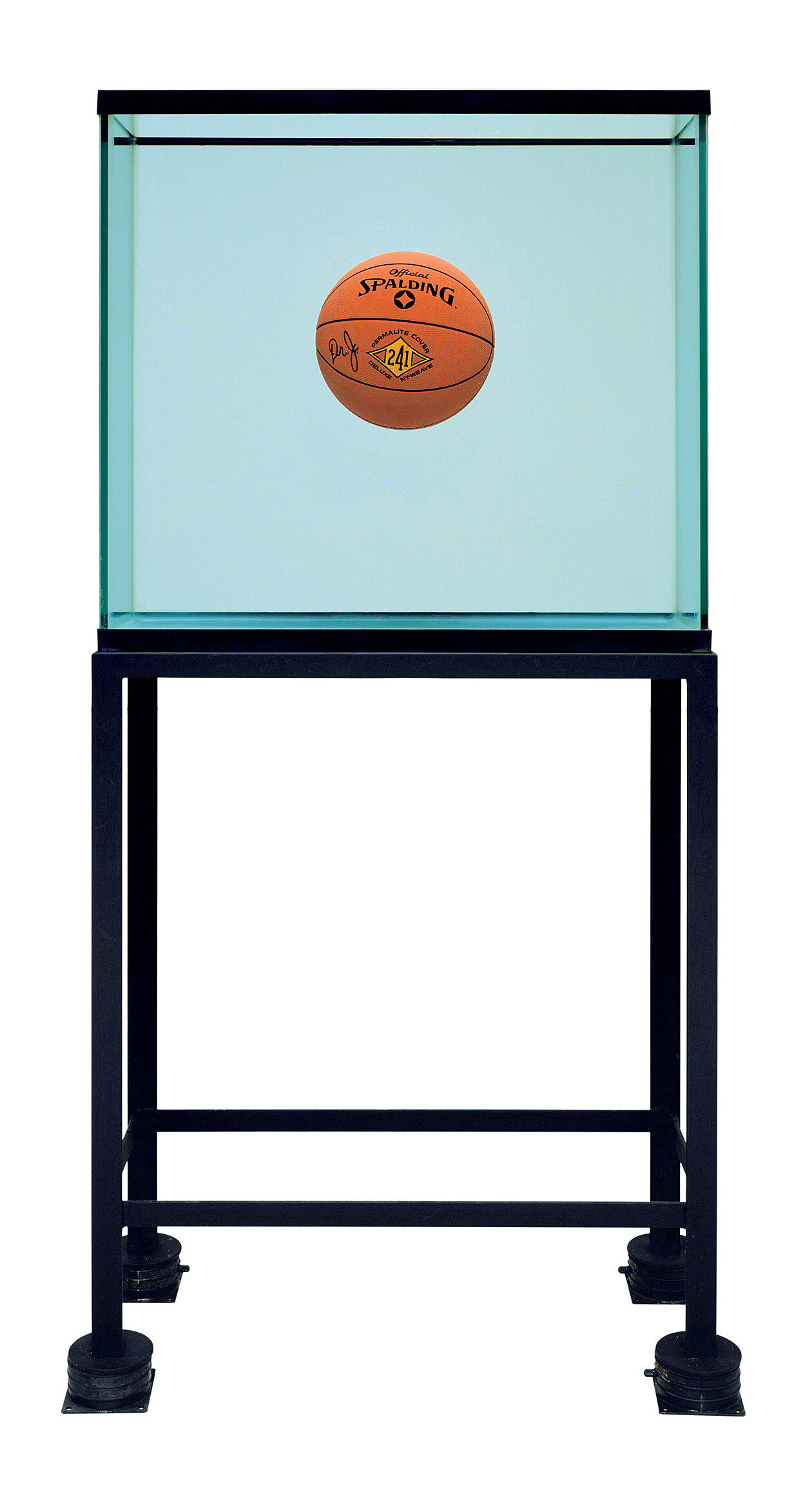 A basketball floating in a glass tank.