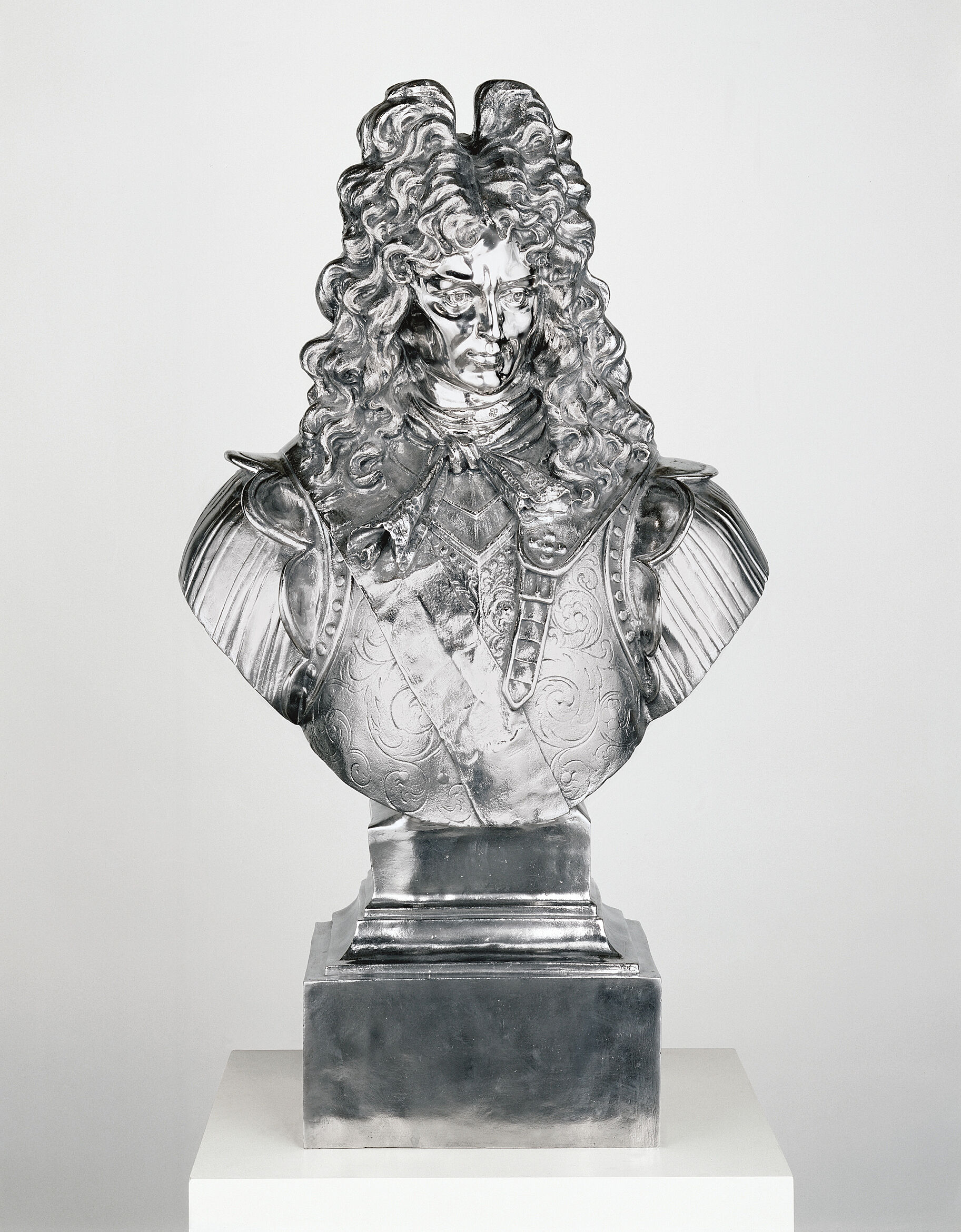 A steel bust of Louis XIV.