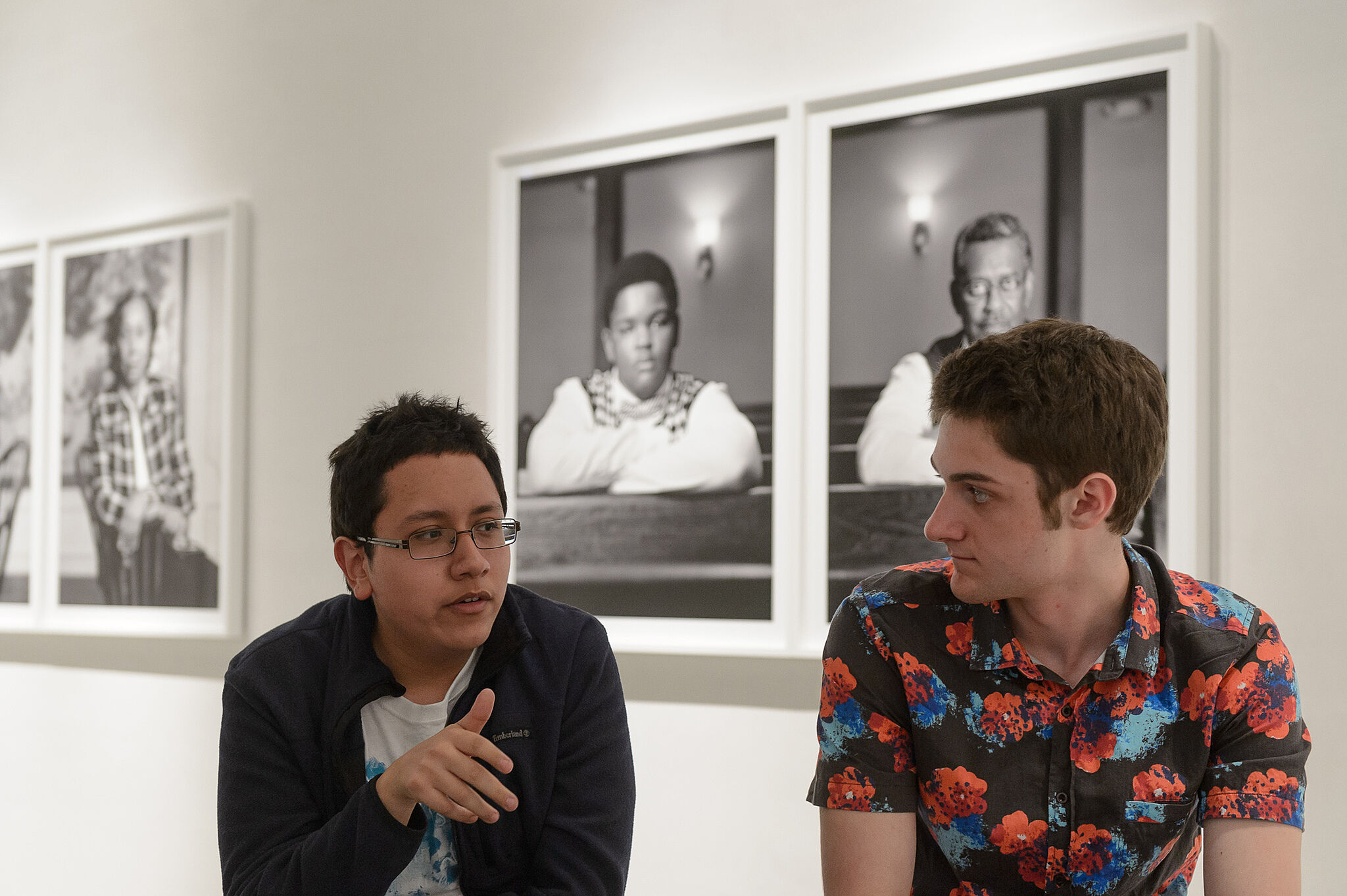 Two youth leaders from the museum in the gallery.