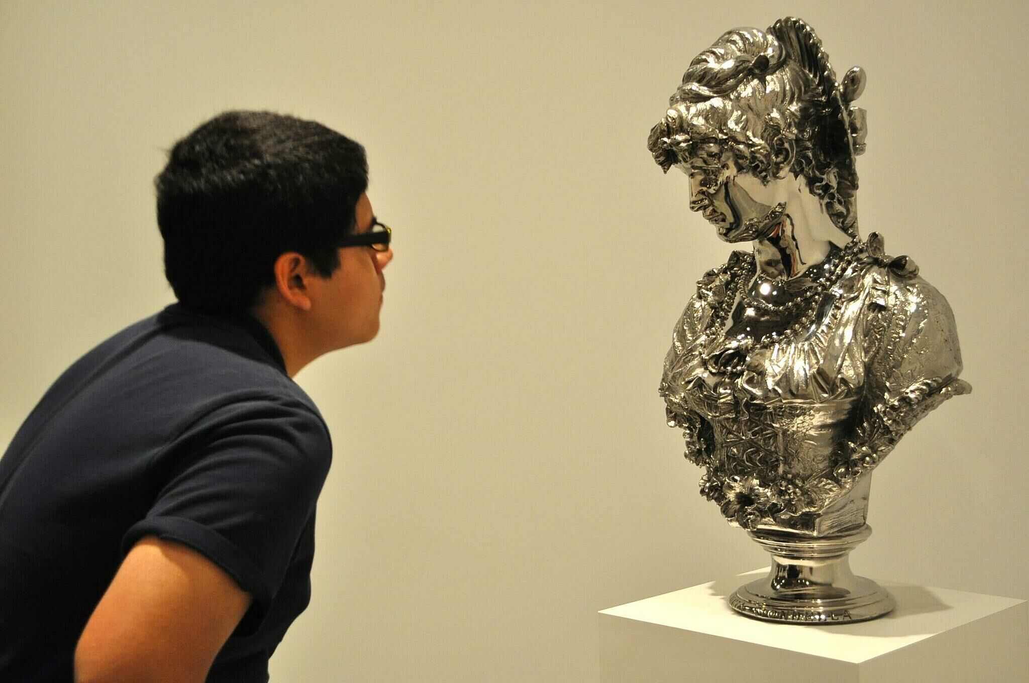 student looking at a bust