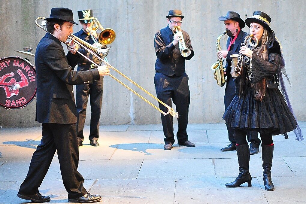 A marching band plays at the Whitney Museum