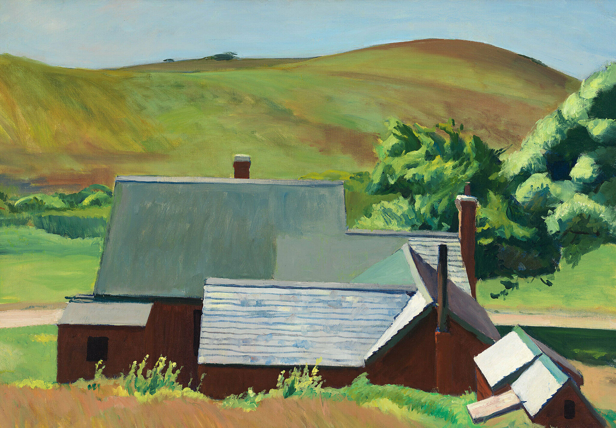 Barn and rolling hills in background.