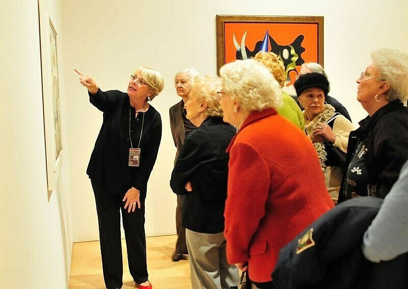 seniors learning about artwork in the gallery