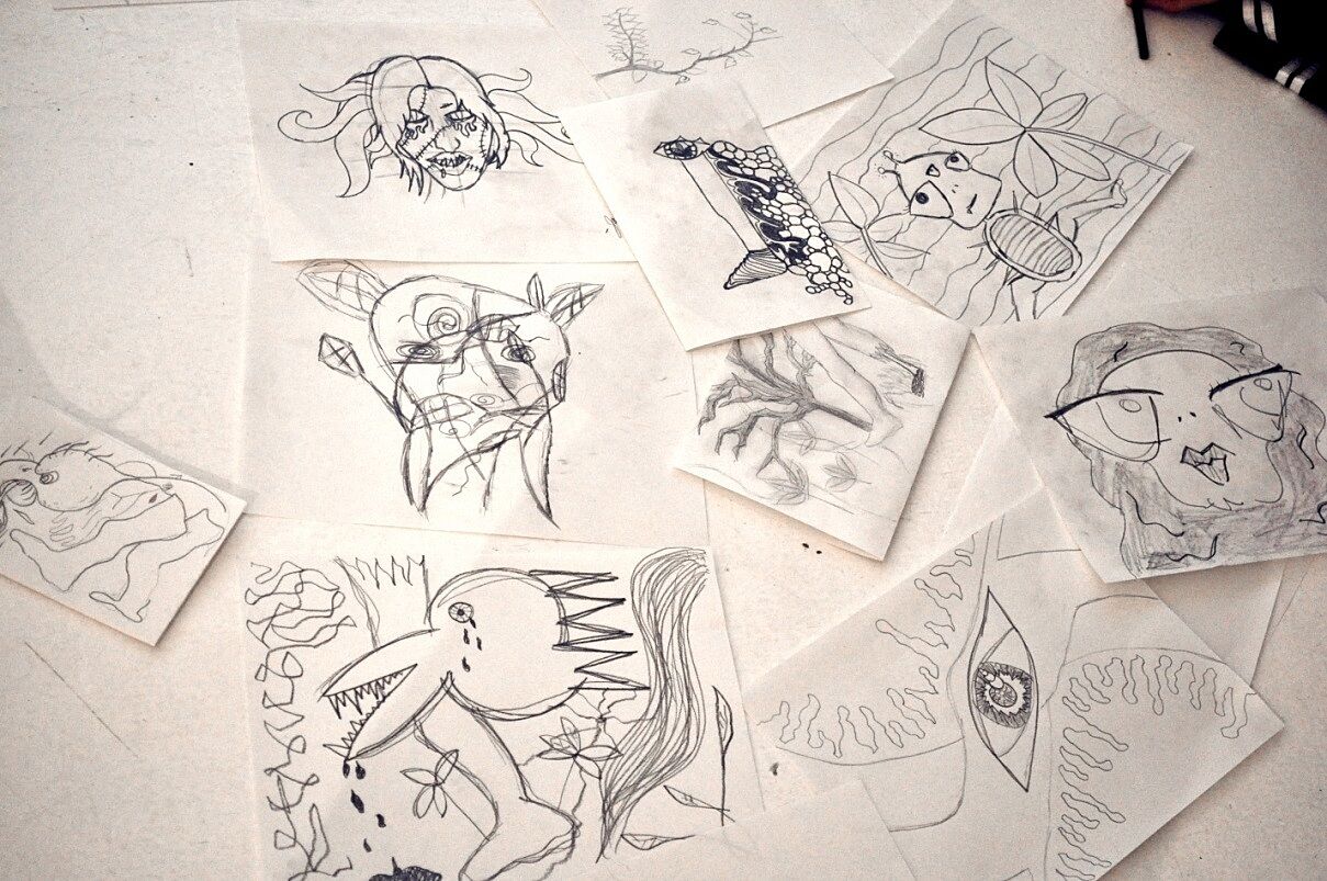 Student's drawings on the floor