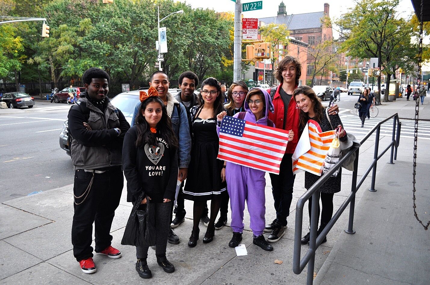 Group students posing with the American flag
