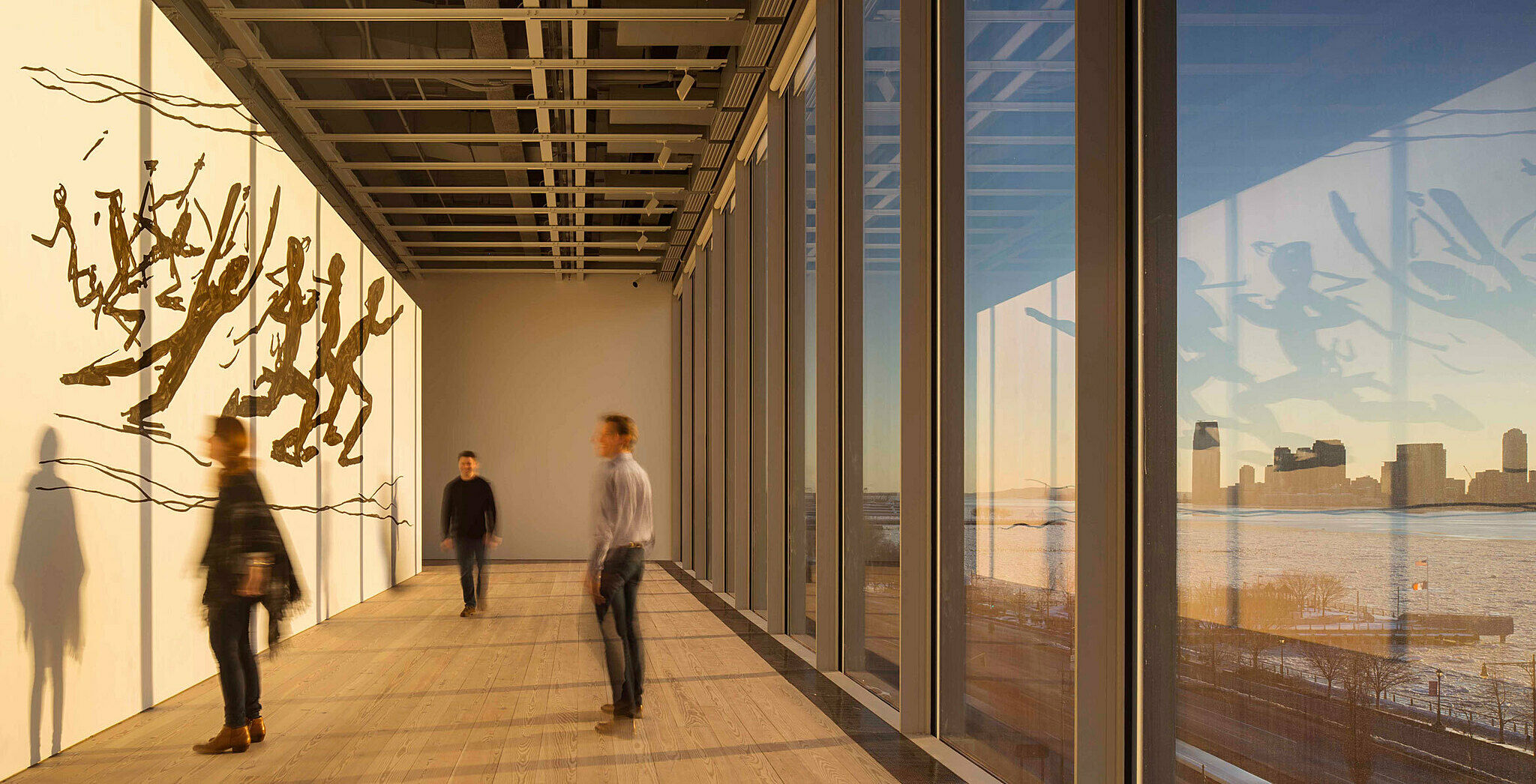 A mural faces the gallery windows and the Hudson River.