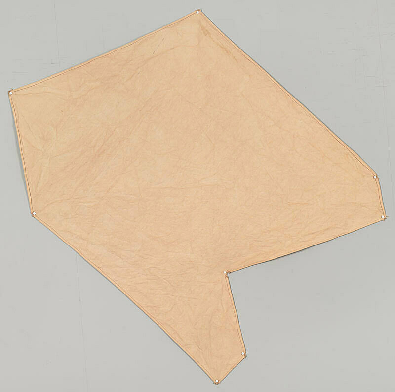 A pink canvas with an irregular angular shape. 