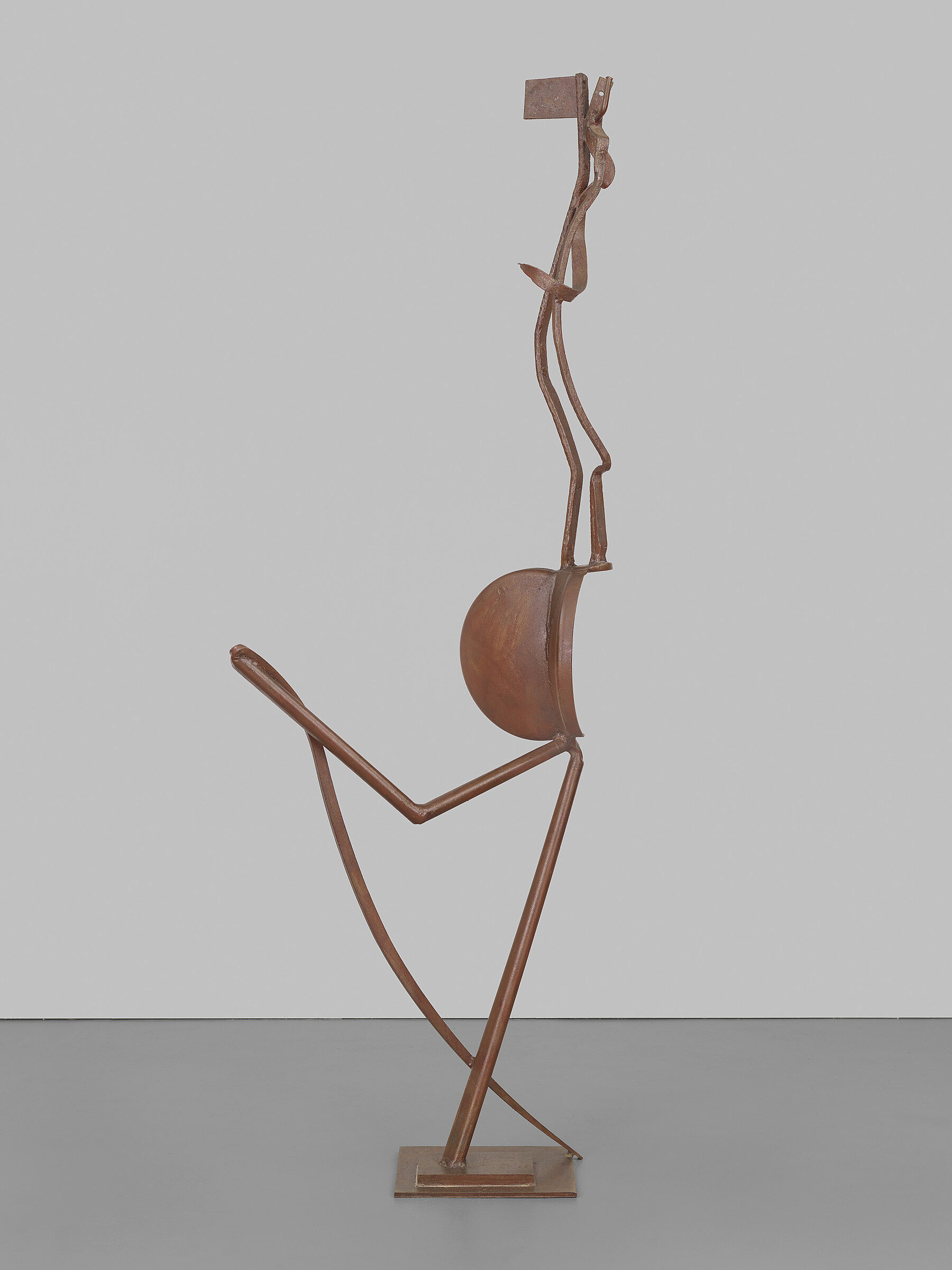 A sculpture of an abstracted human shape.