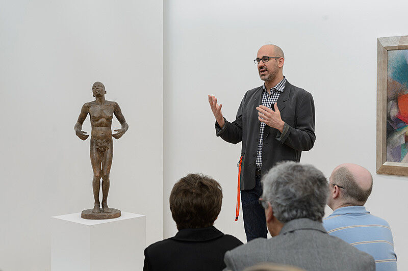 People gathered for a talk in the gallery.