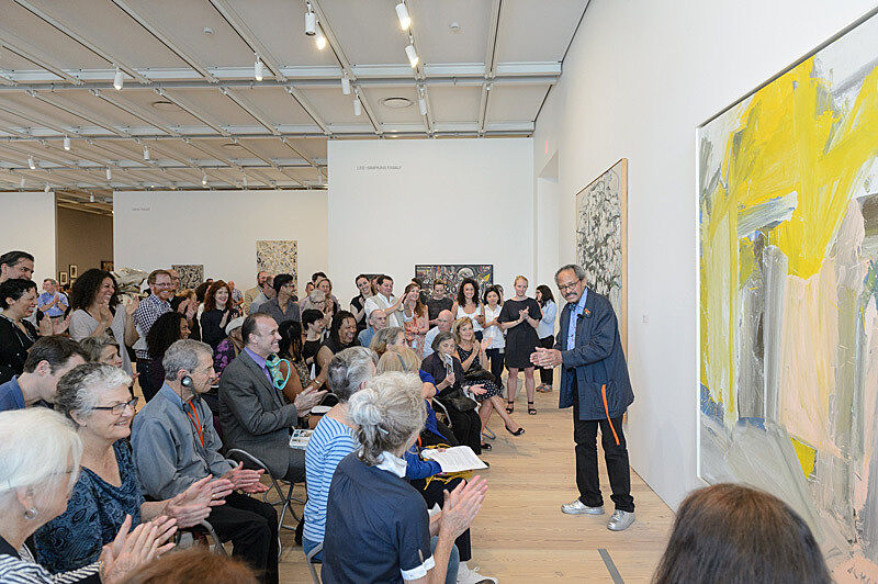 People gathered for a talk in the gallery.