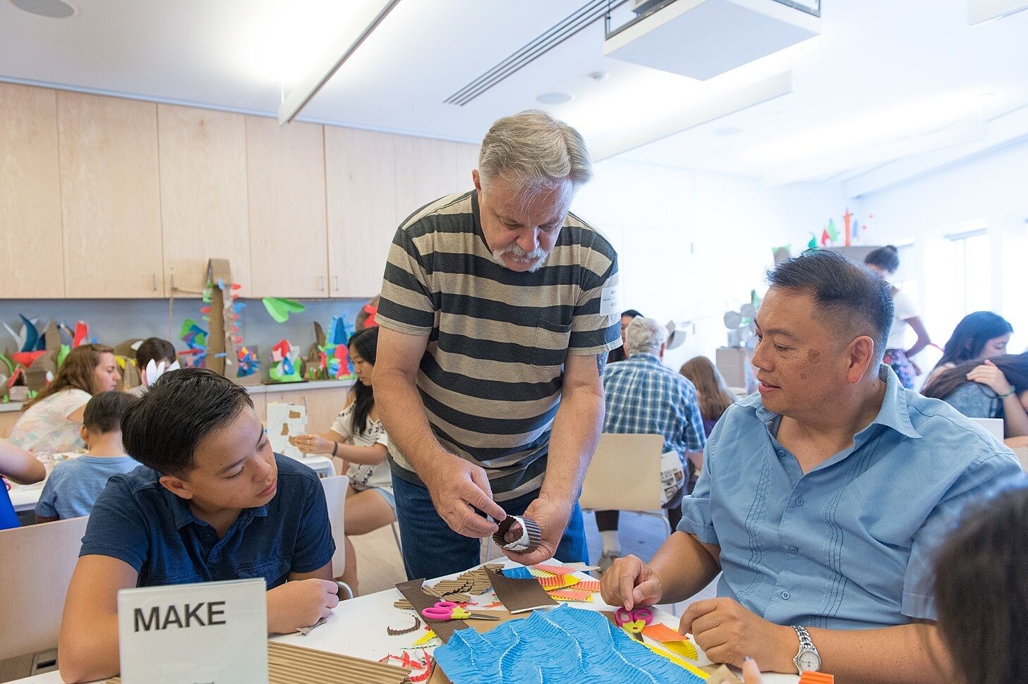 Workshop participants collaborating with artist Tom Berry