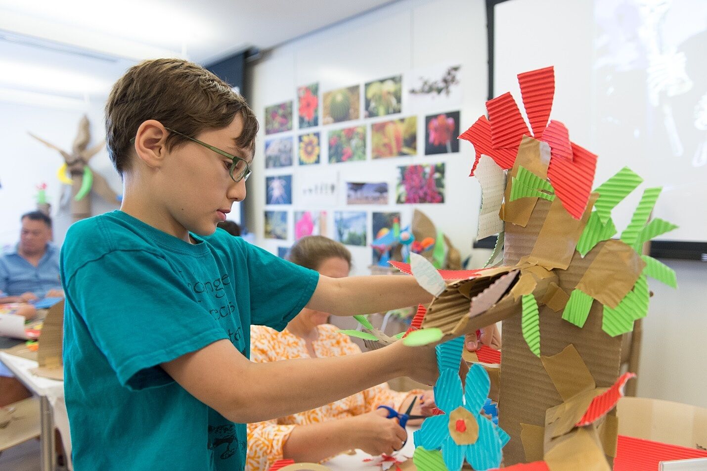 A family creates a cardboard flower