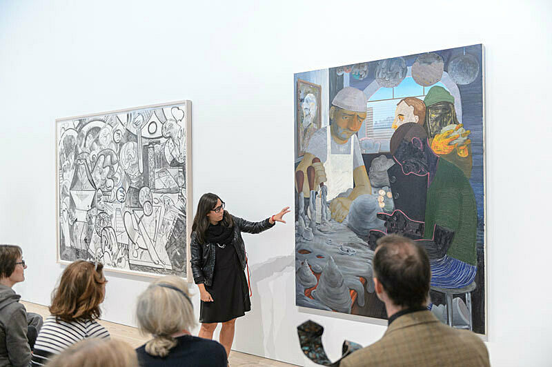 People gathered for a talk in the gallery.