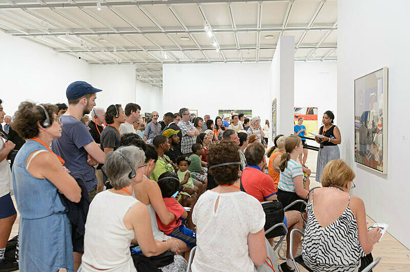 People gathered for a talk in the gallery.