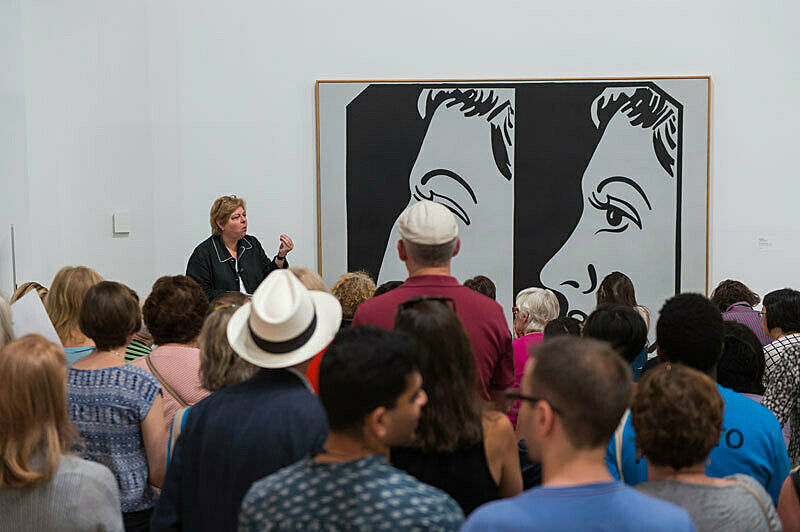 People gathered for a talk in the gallery.
