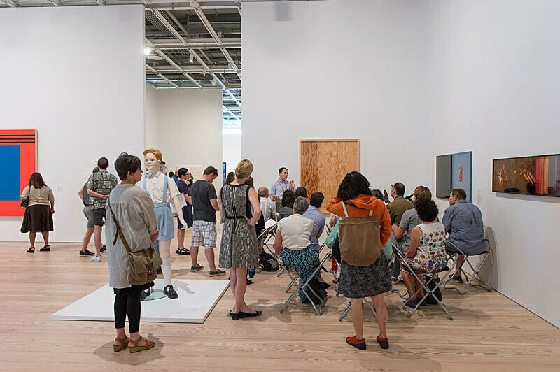 People gathered for a talk in the gallery.