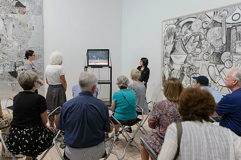 People gathered for a talk in the gallery.