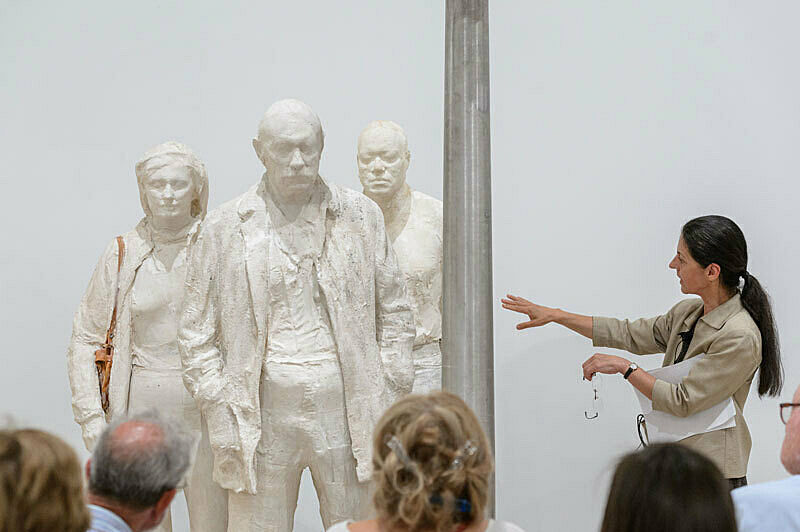 People gathered for a talk in the gallery.
