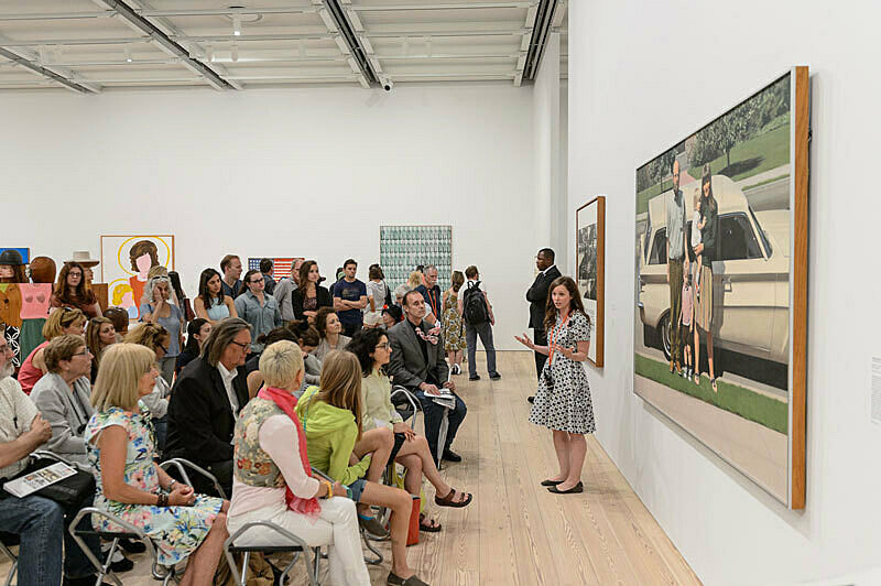 People gathered for a talk in the gallery.